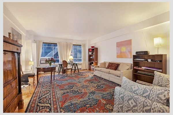 Modern home with living room, chair, bookcase, sofa, coffee tables, table lighting, and light hardwood floor. 45 West 54th Street, Midtown - $450,000
The perfect mid-town pied-a-terre awaits you on this bustling block between fifth and sixth avenues, home to MOMA and several distinguished clubs. 45 West 54th Street is a postwar doorman coop. Apartment 7D is a spacious south-facing studio with two large windows, separate kitchen facing south with window, nice sized foyer and separate dressing room and bath. There are plenty of closets and extra storage and laundry room in the basement. Photo 2 of Five Fabulous NYC Homes For Under $500K