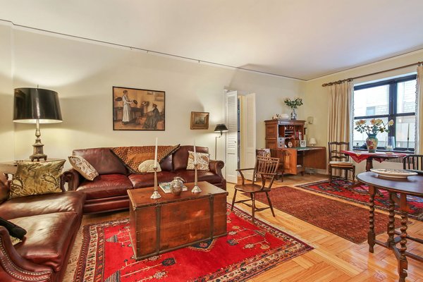 Modern home with living room, chair, console tables, sofa, floor lighting, table lighting, and light hardwood floor. 225 East 74th Street, Upper East Side - $460,000
Well established coop on leafy 74th street between 3rd and 2nd Avenues. The foyer leads to a single step-down living room creating an open sweep. The renovated "like new" kitchen has both a door to the foyer and open counter to the living room. A large separate space with closet and renovated bath adjacent offers multiple options. Pets, Guarantors, Pied-a-terres, washer/dryer OK. Storage, laundry, bicycle room in basement. 24 hour doorman. Live-in Super. Washer/dryer in apartment with Board approval. Photo 3 of Five Fabulous NYC Homes For Under $500K