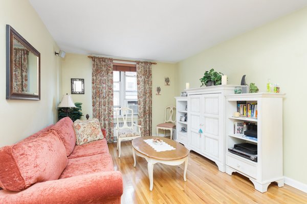 Modern home with living room, sofa, bookcase, chair, coffee tables, floor lighting, table lighting, wall lighting, and light hardwood floor. 221 McDonald Avenue, Windsor Terrace - $479.000
This one bedroom co-op in leafy Windsor Terrace awaits. Upon entering the large foyer with its one out of 5 closets, you will immediately notice the gleaming hardwood floors which are laid throughout. Straight ahead, the windowed kitchen has been renovated complete with stainless appliances, granite counter tops and cherry cabinets. The living room at 17' deep has enough space for living as well as a full dining area. The large bedroom has storage as well as dual exposures. Maintenance includes heat, gas and electric. Building has common laundry, bike storage, courtyard and manicured green lawns. Parking space is available via wait list. Close to transportation. Showings by appointment only. Photo 4 of Five Fabulous NYC Homes For Under $500K