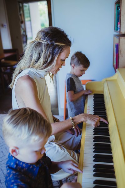The piano was Young’s wife's when she was growing up and it was originally a very boring, oak brown. “We wanted it to be the signature feature of the room and painting it yellow is always a fun surprise when you walk in the room. This is the room you can find us in most nights playing board games, playing piano, and drinking wine.” Photo 9 of 1600 Lakeside modern home