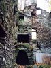 The layers of life can be seen here. A large root cellar on the lower walk out level, with a walk in fireplace on the second/main story and a smaller corner fireplace on the top/3rd floor bedroom area. The stairs would be where the the photographer was standing here. Plus if you look closely, you can see a round hole in the fireplace wall on the third floor level. This hole was an exhaust inlet for a wood stove, which was a later addition to the original homestead. When the invention of the wood stove took off, heating had never been more convenient. This 1,600 sqft homestead had at least four wood stoves based on the various stove exhaust inlets into the masonry chimneys. It would have been toasty warm. Photo 5 of Screaming for Life - circa 1680's Homestead, Bucks County Stone House modern home
