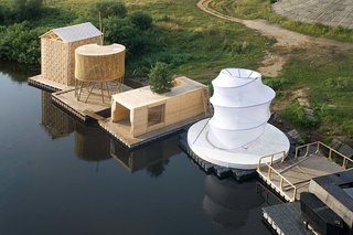 Escape to One of These 10 Otherworldly Outdoor Saunas - Photo 8 of 10 - The firm's Kaluga Floating Sauna sits with other floating structures by Norman Foster, Francois Roche, Vladimir Plotkin, and others.