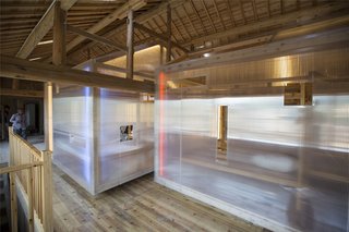 The interior features gabled volumes feature with timber frames clad with translucent polycarbonate, making them lightweight and portable. 