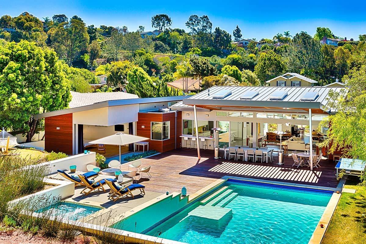 Designed by Tim Golba, this 3,400-square-foot home is walking distance to the La Jolla beaches. The home was constructed as a modernist oasis, with an emphasis on reflecting the peace and tranquility of the La Jolla landscape. The home features disappearing glass walls and a spacious, minimalist interior aesthetic that unites concrete and glass under soaring ceilings and extended outdoor living areas.