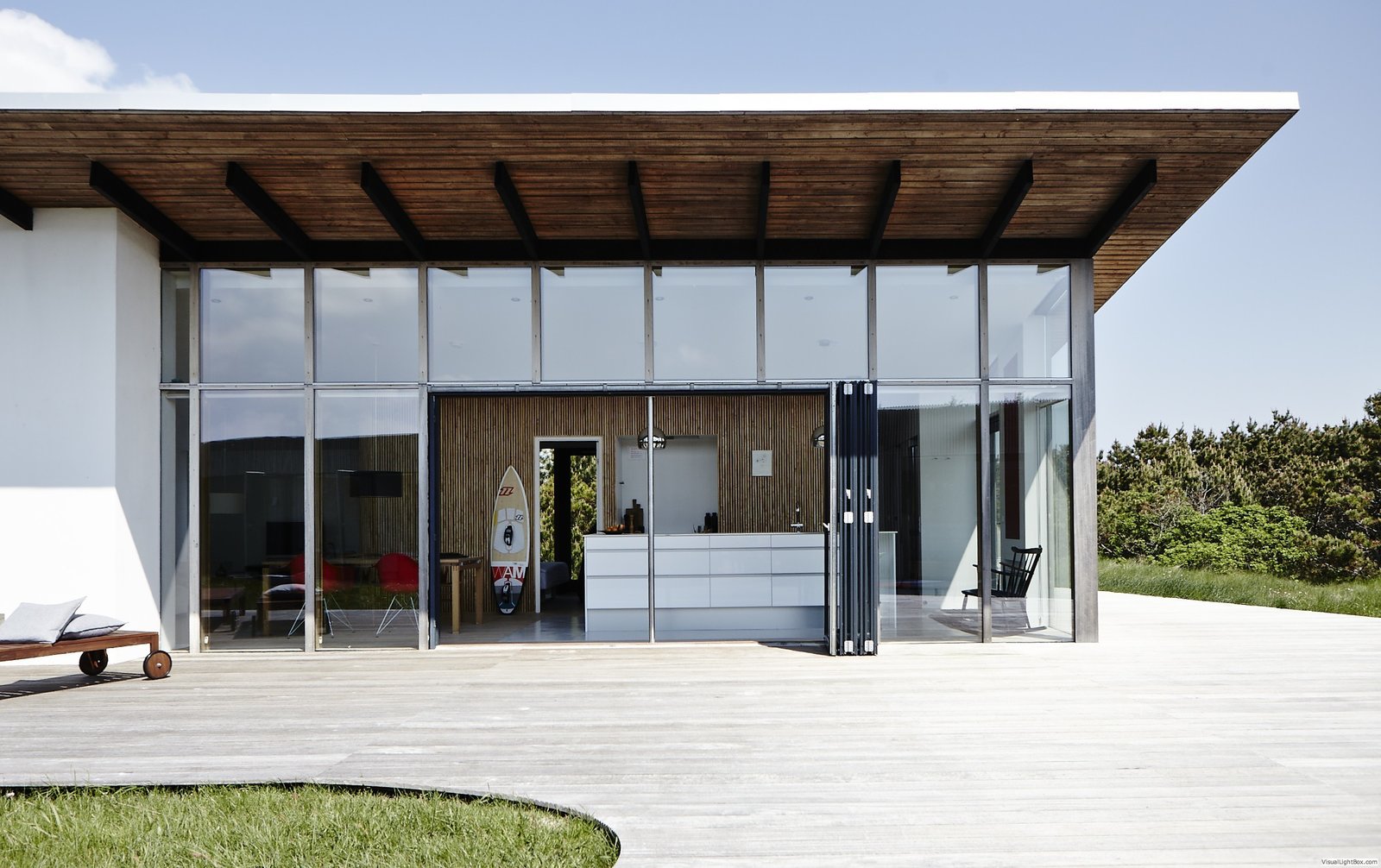 Located on the western Danish coast within walking distance of the North Sea, this home was designed by Soren Sarup to integrate elements of the surrounding landscape and to highlight natural, contemporary beauty. The interior fuses clean-lined simplicity, an abundance of wood surfaces, and a restrained mix of Danish-modern and vintage furniture to create a visually stimulating yet relaxing environment that extends between indoor and outdoor living spaces.