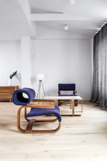A Family’s Loft in Poland Gets a Minimalist Renovation That’s Both Elegant and Functional - Photo 2 of 12 - Armchair designed by Jan Bocan (1972)