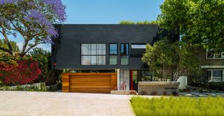 The design of this Pacific Palisades home was driven by the neighborhood's hillside ordinance. After studying various versions of the property, the architects decided that by dropping the street facade by four feet, they would be able to achieve a more linear design. A rooftop deck allows the homeowners to enjoy panoramic views of the Pacific Ocean.
