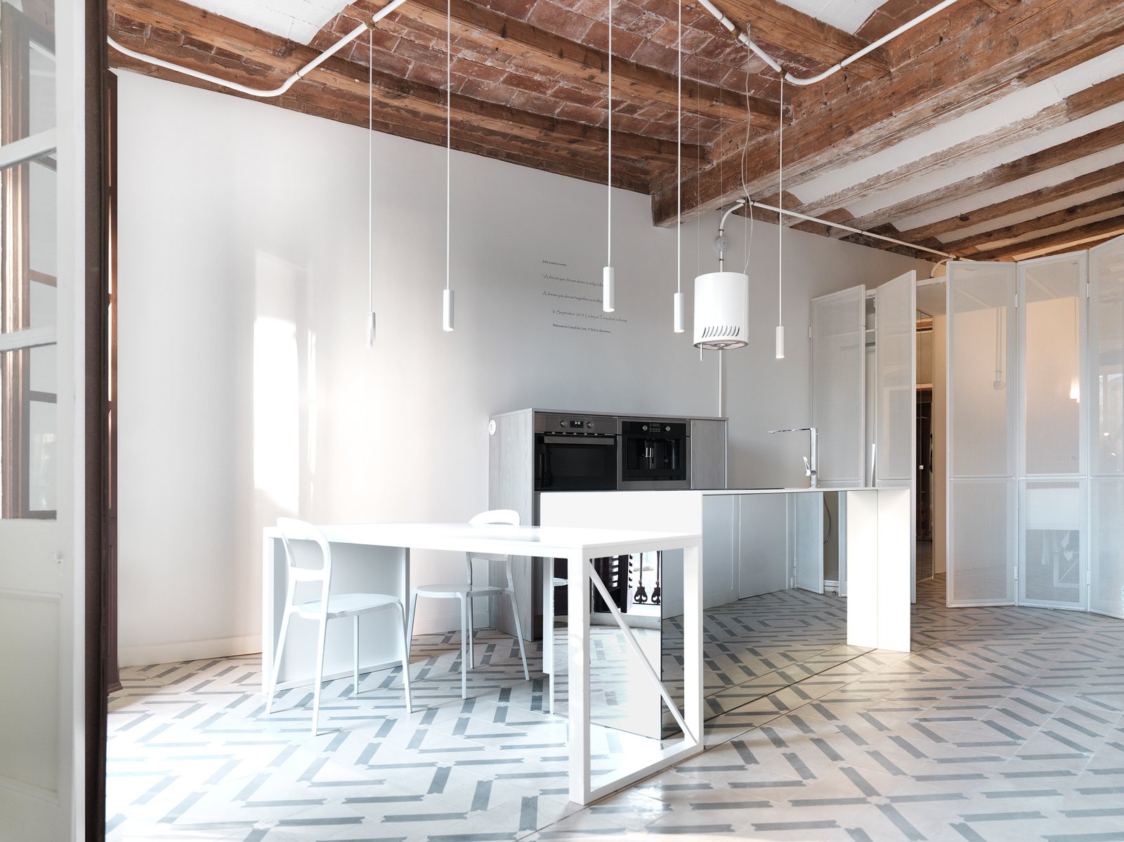 The kitchen is pivot of the house. All Lighting is custome made by the architects