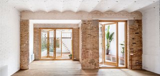 A Dramatic Apartment Renovation in Barcelona Features Salvaged Tile and Brick - Photo 2 of 13 -