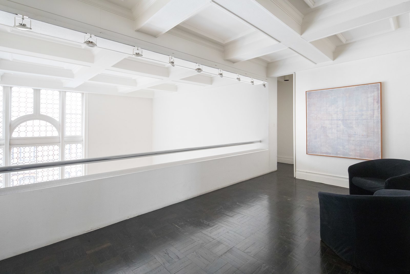 An upstairs gallery overlooks the living room.