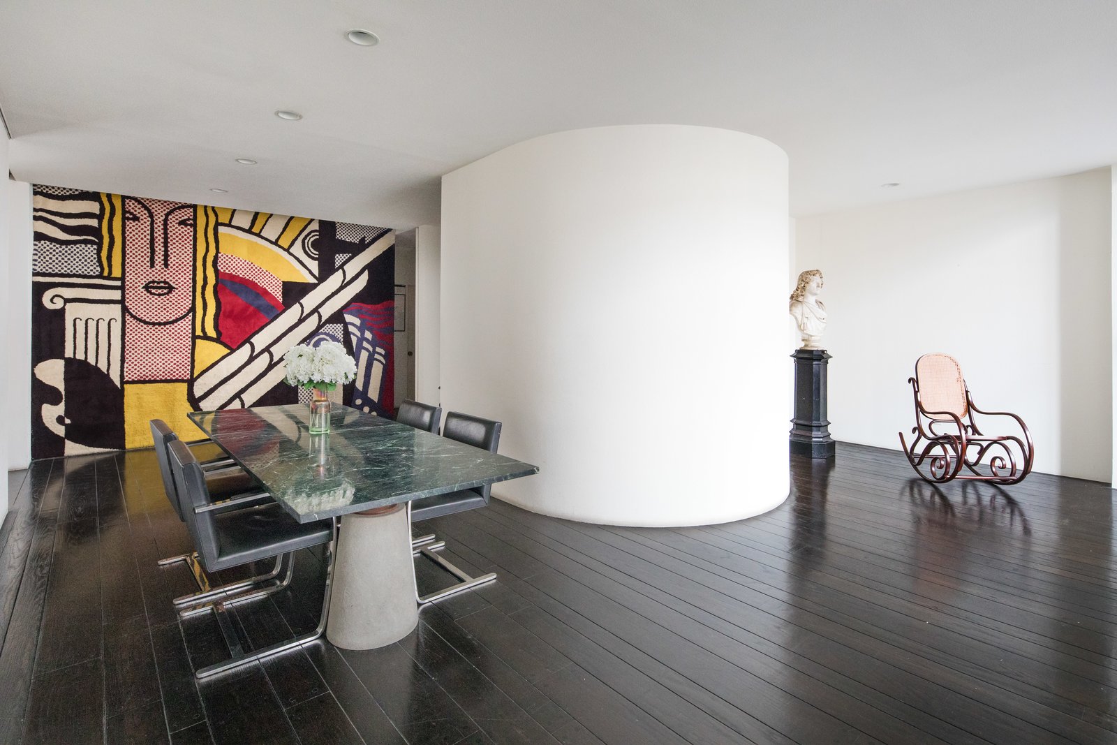 A close-up of the dining room with large scale art.