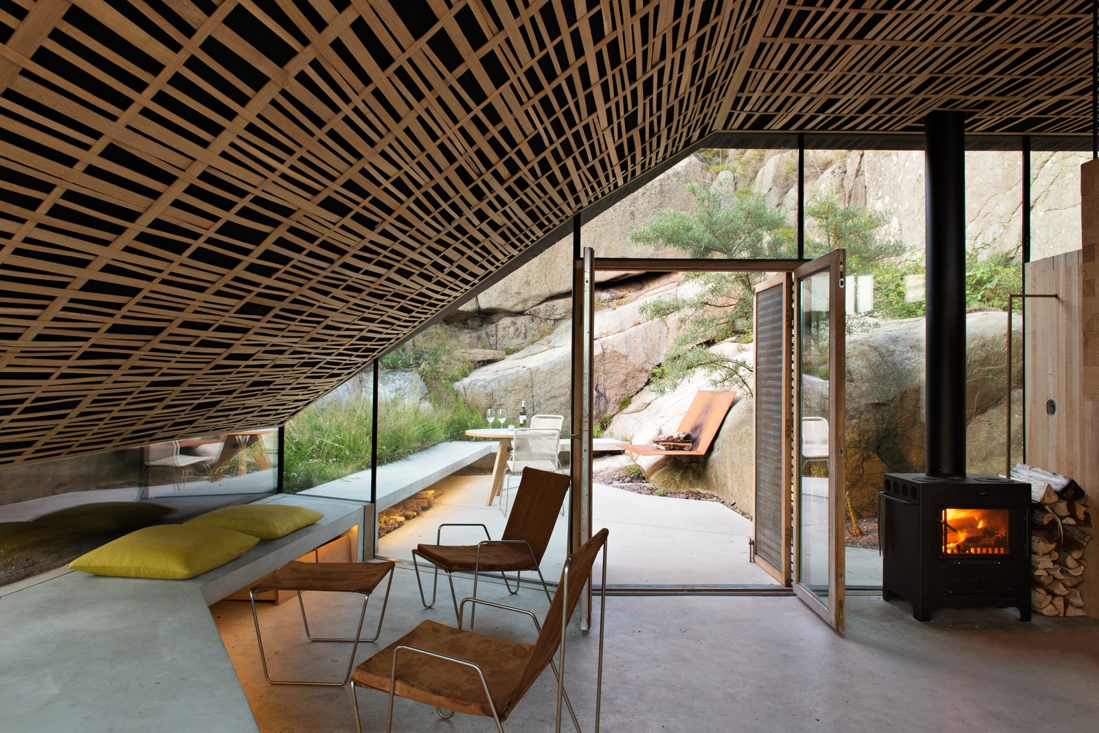 The long bench is made with the same white concrete as the roof.