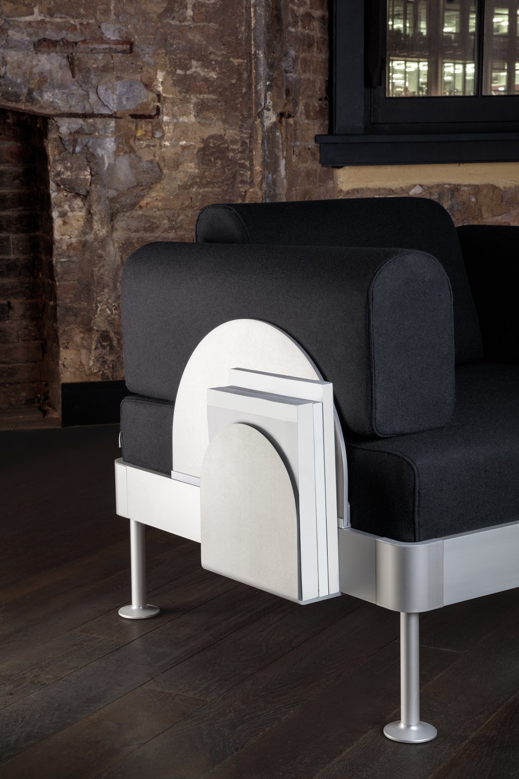 A sleek, scalloped magazine rack