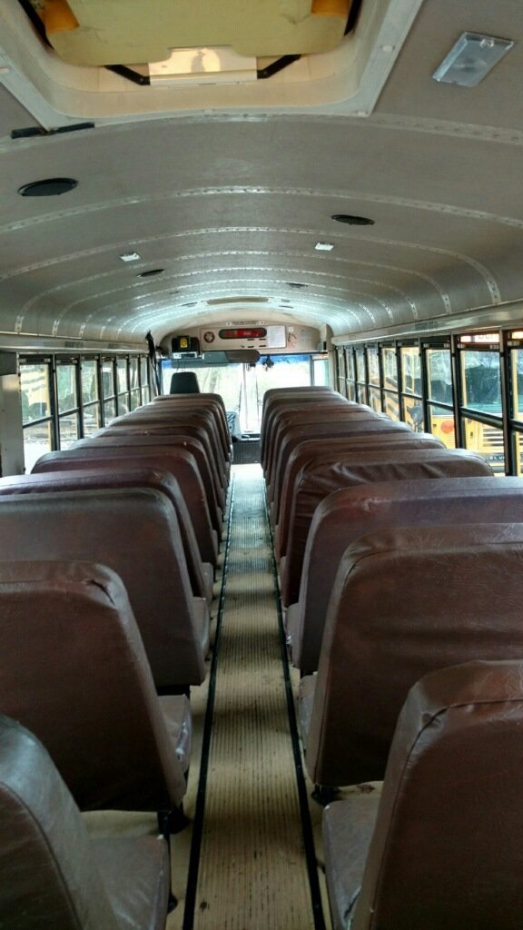Looking toward the driver's seat, with all of the bus seats still intact.