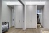 Modern home with Interior, Metal, Sliding Door Type, Bed, Boy Gender, Toddler Age, Medium Hardwood Floor, Bedroom, Playroom, Closet Storage Type, Wood, and Bedroom. Lower level: Children's Bedrooms
On the lower level, the use of pocketed sliding doors met an imperative client requirement. It allowed the children’s bed/playroom to be a flexible space - subdivided for sleep and open for play. Additional sliding glazed doors at the two entries to the bedrooms from the family room, facilitate deep penetration of natural indirect daylighting from the bedroom windows into the family area. Photo 13 of Noho Duplex, New York