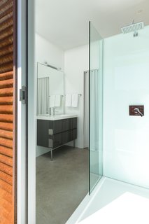The master bath enjoys another outdoor shower.