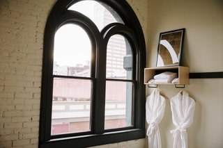 A Chic Portland Hotel Offers Lodging As Affordable as $35 a Night - Photo 8 of 10 - The original dark wood window frames and exterior brick walls remain intact. Simple, modern additions provide amenities in the guest rooms.