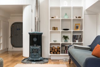 Londoners Can Live in This Scandinavian-Inspired, Converted Barge For $424K - Photo 5 of 9 - An original 1920s Goodin Woodburning Stove anchors the cozy living space. 