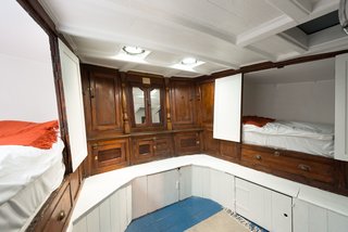 Londoners Can Live in This Scandinavian-Inspired, Converted Barge For $424K - Photo 6 of 9 - The bunk room provides built-in sleeping quarters within the original woodwork. 