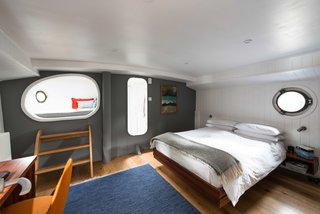 Londoners Can Live in This Scandinavian-Inspired, Converted Barge For $424K - Photo 7 of 9 - The Master Bedroom includes a private ensuite, desk, and "snug" space accessed via a step ladder. 