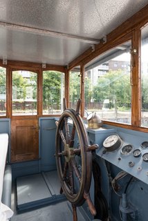 Londoners Can Live in This Scandinavian-Inspired, Converted Barge For $424K - Photo 8 of 9 - The Wheelhouse has been fully restored and provides 360-degree views through the glazing.