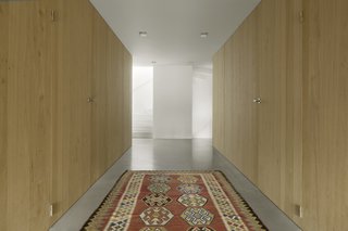 A Converted Warehouse in Amsterdam Boasts Soothing Interiors of Concrete and Wood - Photo 6 of 9 - The white stair ascends upward as a light-filled, sculptural element.