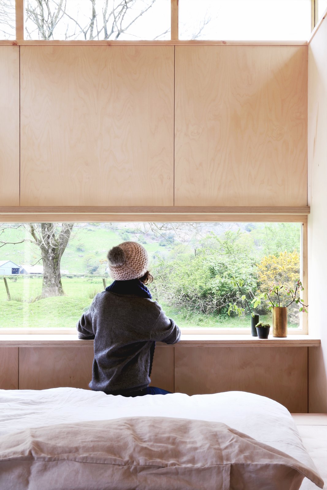 A built in ledge set directly at the window provides a desk surface.