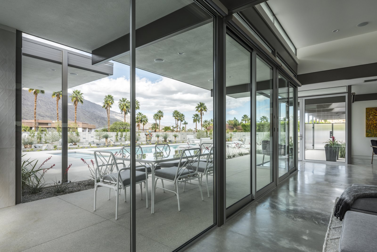 Living spaces are provided not only on the interior, but the exterior as wall. Large overhangs provide some protection while in the outdoor elements.