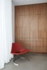 Modern home with Office, Study, Chair, Concrete Floor, and Storage. In 2015, the owner of Bo-Ex in Denmark, made the last Scimitar Chair before closing his factory in 2016. The chair is hand made at the original factory in Denmark with the original tools of the 1960's. To preserve the authenticity and high quality the leather has been shipped from Denmark to Italy where an authentic sewing machine was located to stitch the leather before shipping it back to Denmark to finalize the chair. The name of this rare chair is derived from the Turkish sword. Photo 7 of Santa Monica Residence