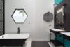 Modern home with bath room, ceramic tile floor, pedestal sink, and freestanding tub. A Zucchetti Kos Italian imported tub serves as an anchor piece in the master bath. Zucchetti vanities and fixtures along with creative color-block Hexagon pattern floor tiles, Flos String Lights designed by Michael Anastassiades, and a custom hex Fleetwood window present a clean and streamlined feel and the ultimate of bespoke design expression. Photo 10 of Via Tiempo