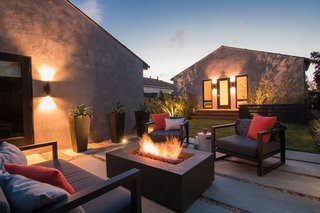 Merging Inside and Out, an L.A. Firm Modernizes a 1940s Abode - Photo 17 of 18 - Backyard Seating & Fire Pit at Night