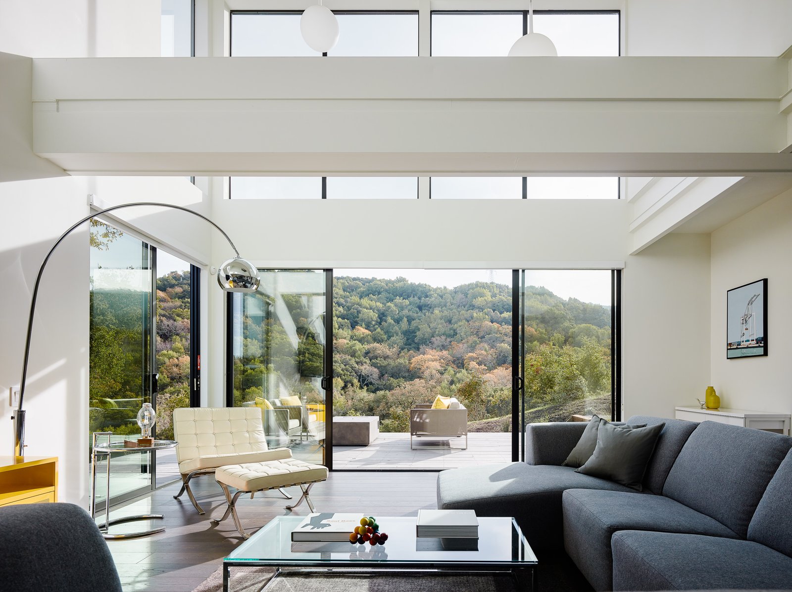 Natural light pours through the copious windows, filling the living areas with a sense of buoyancy, and allowing an unobstructed view of the vista beyond.