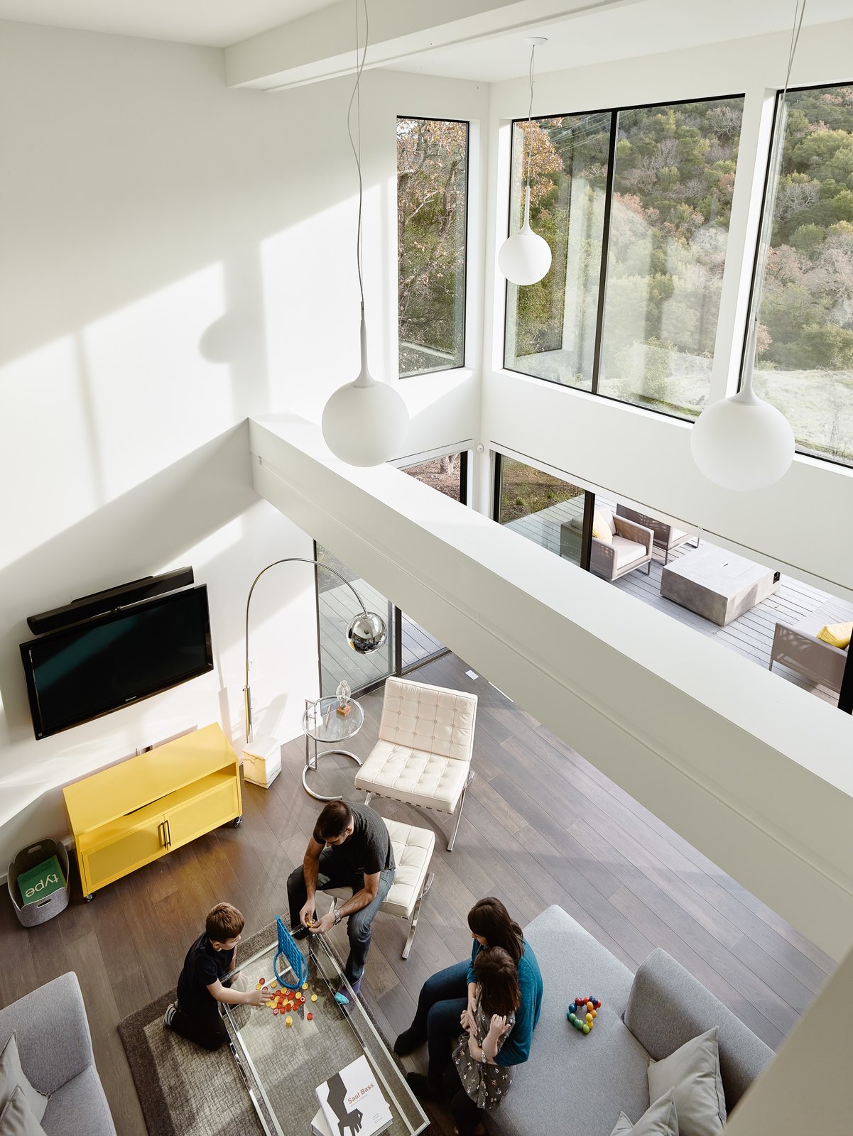 19' ceilings in the living room maximizing natural light to permeate the open spaces.