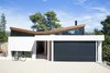 Modern home with exterior, house, shingles roof material, and stucco siding material. Two distinct blocks, facing north and west, sit on different levels, and come together in the middle with a wedge-shaped volume that forms the entrance and the vertical circulation leading to the main spaces of the house. A butterfly roof, which reverses the conventional icon of the pitched roof house, lets natural light to enter through those high windows on the back side of the building Photo 6 of The Wedge House