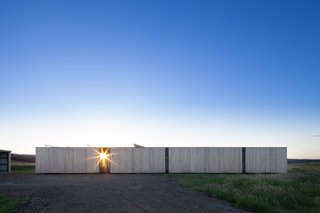 Two Families Embrace Off-Grid Living in This Sustainable Prefab Home - Photo 1 of 9 -