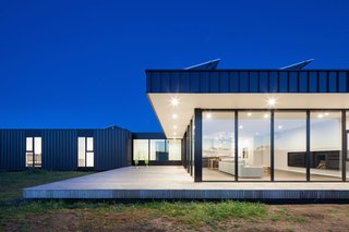 Two Families Embrace Off-Grid Living in This Sustainable Prefab Home - Photo 2 of 9 -