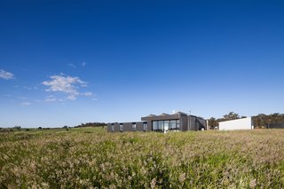 Two Families Embrace Off-Grid Living in This Sustainable Prefab Home - Photo 3 of 9 -