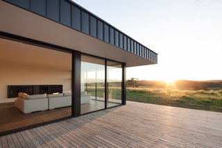 Two Families Embrace Off-Grid Living in This Sustainable Prefab Home - Photo 4 of 9 -