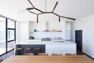 Two Families Embrace Off-Grid Living in This Sustainable Prefab Home - Photo 6 of 9 -