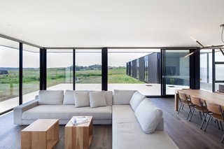 Two Families Embrace Off-Grid Living in This Sustainable Prefab Home - Photo 8 of 9 -