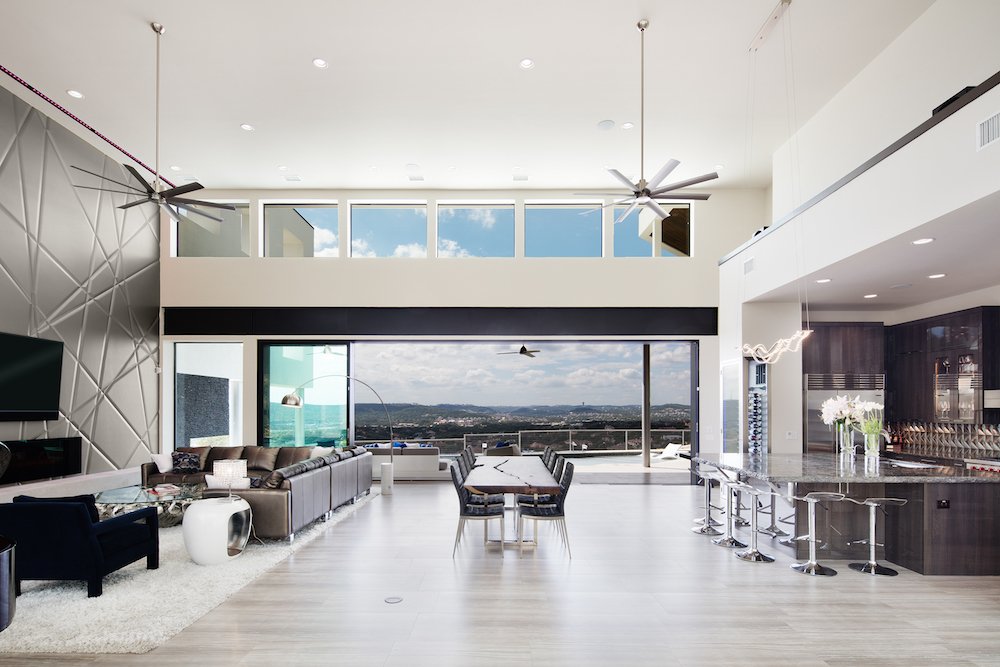 Glass walls open this living room up to the outdoors.