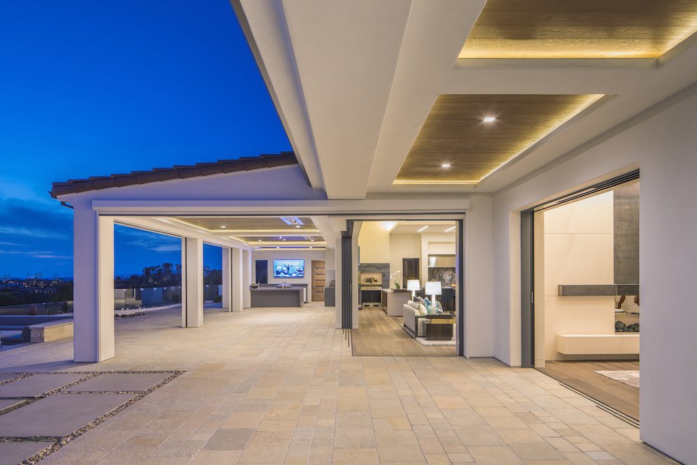Pocketing glass doors slide out of sight.