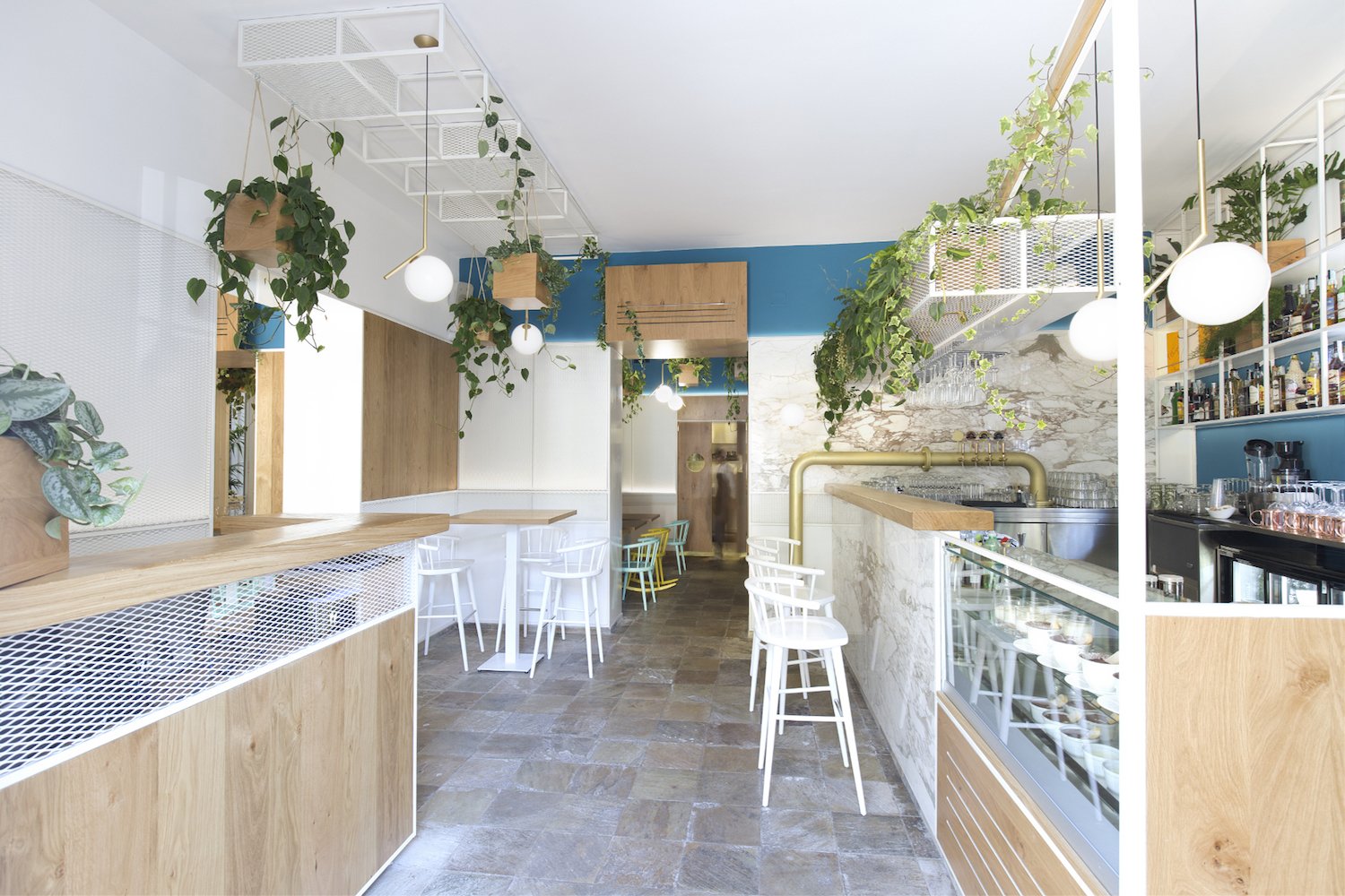A minimal but elegant materials palette keeps the restaurant looking bright and airy.