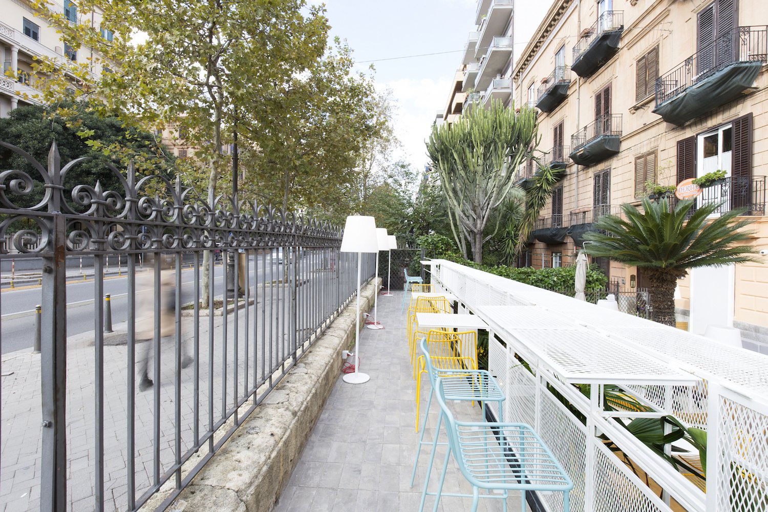 White iron grids form tabletops and dividing screens.