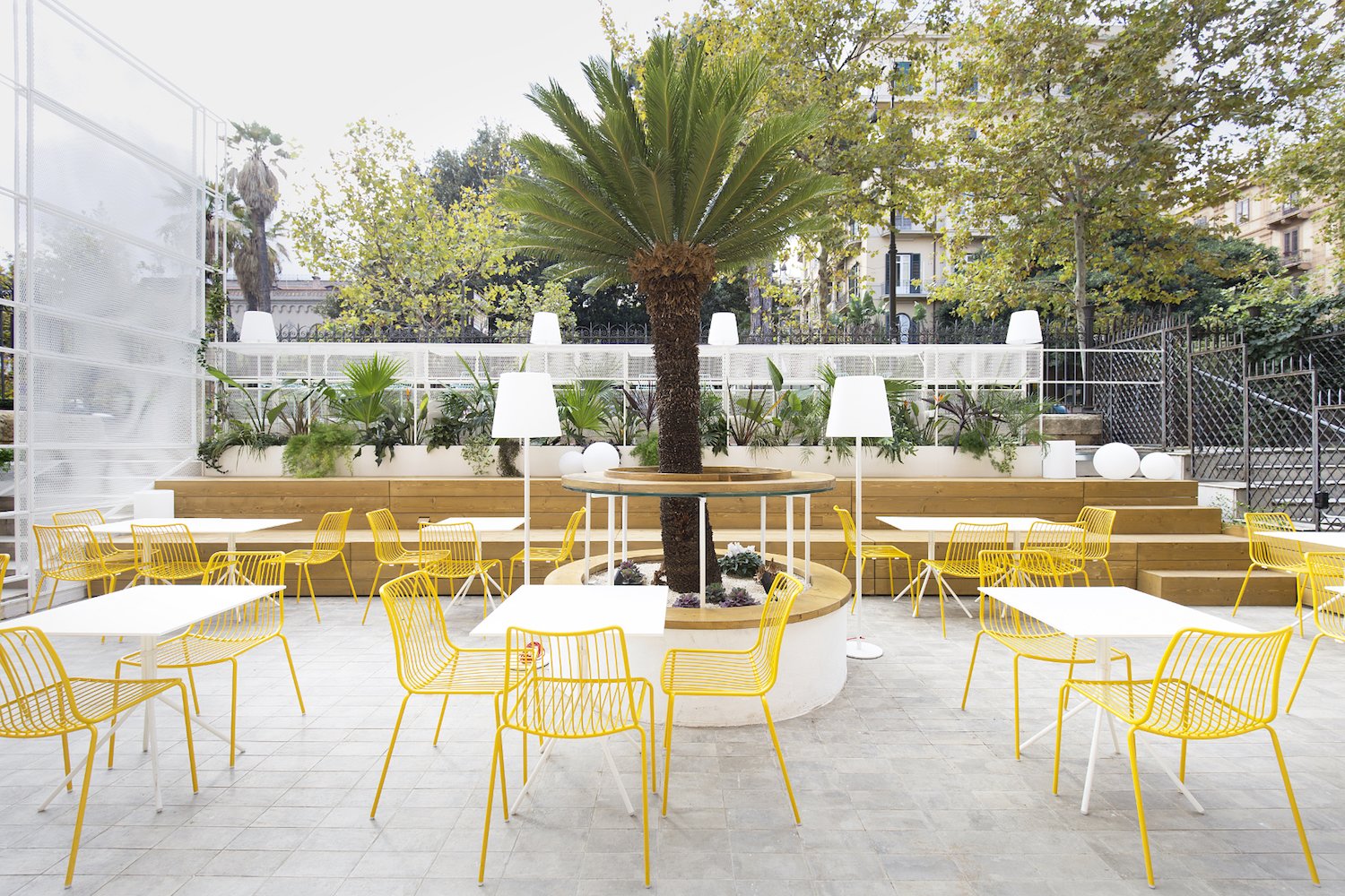 Bright yellow seating injects vibrancy into the space.