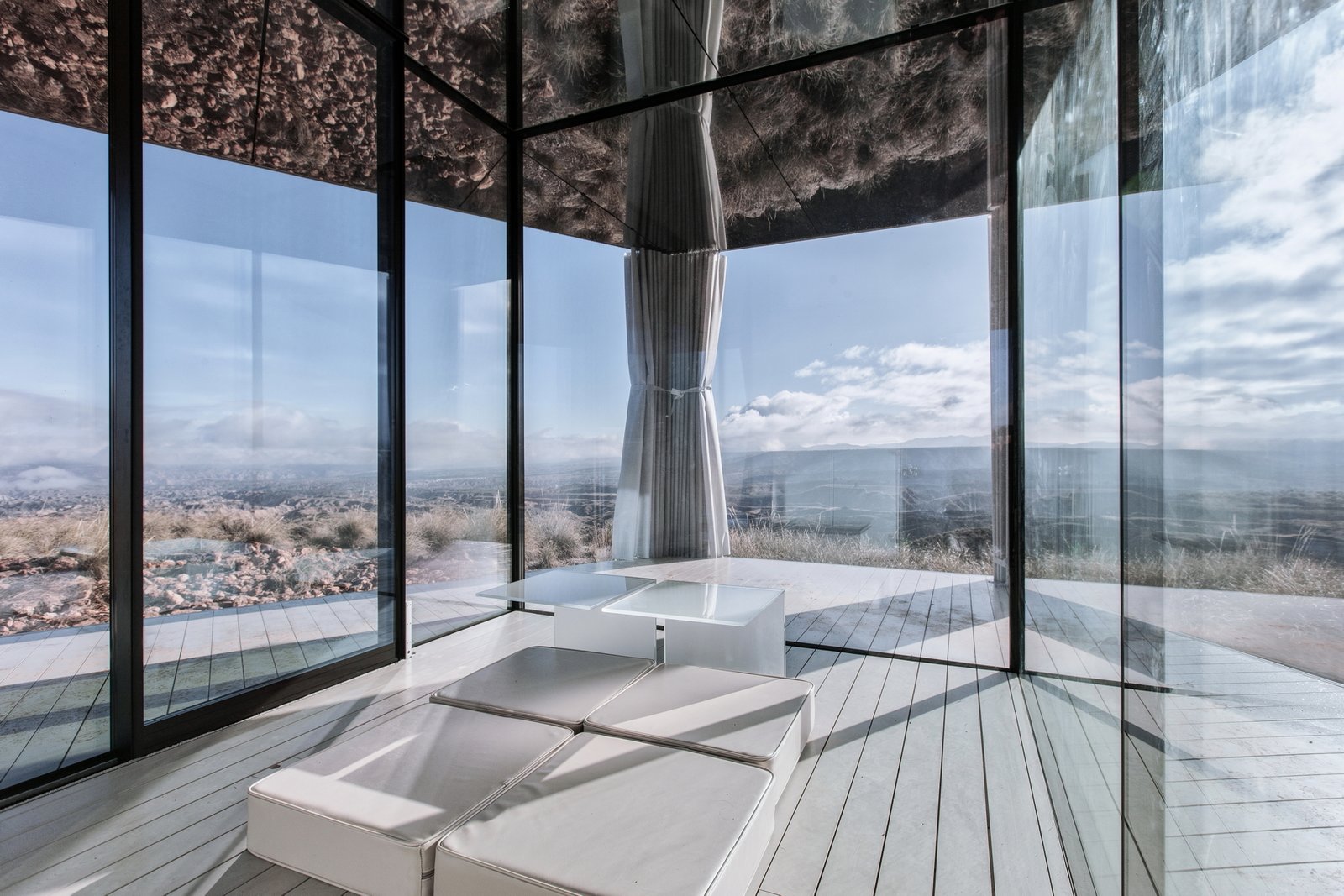 Curtains can be pulled along an integrated track for greater privacy or shade.