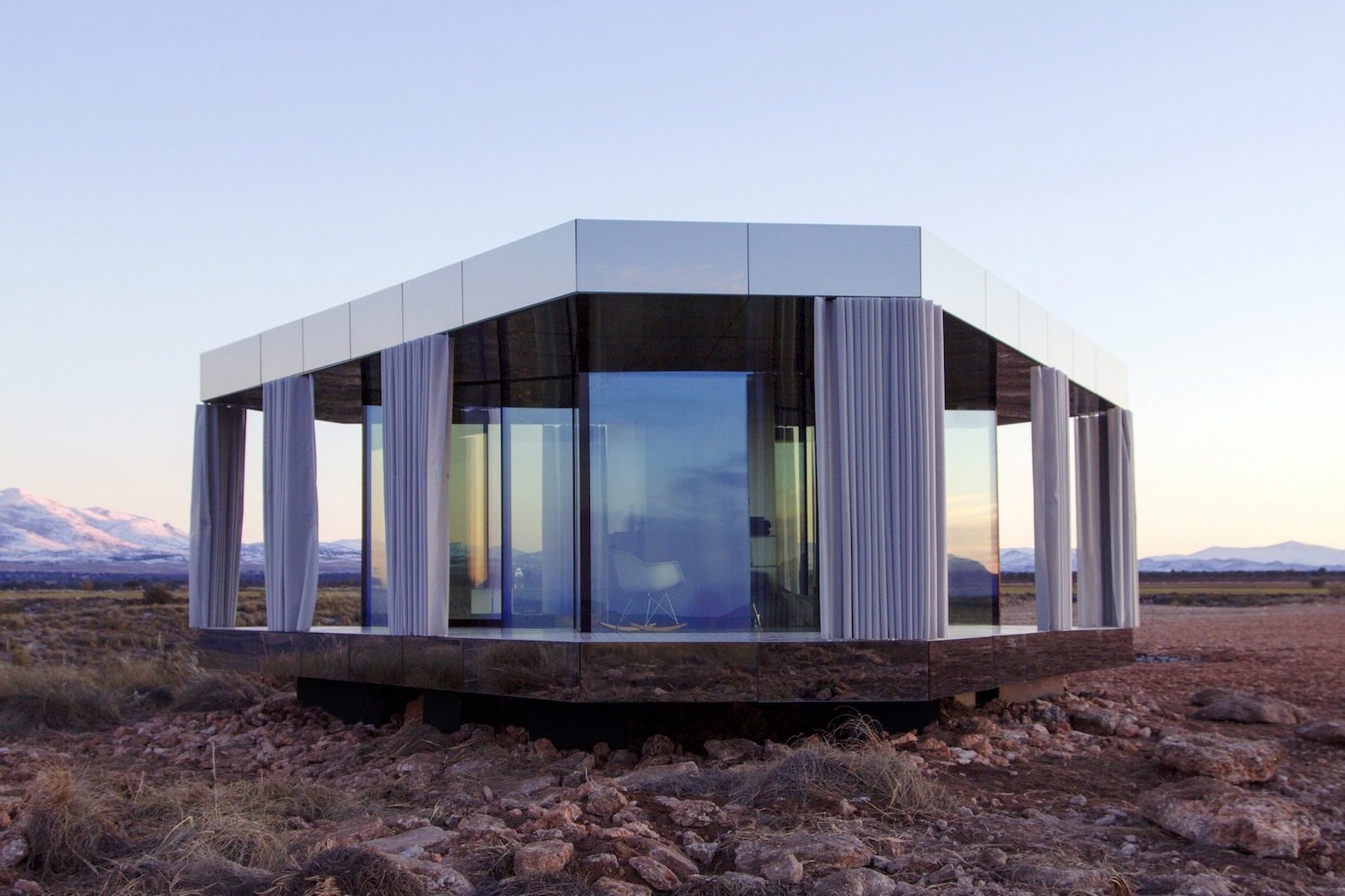 Mirrored panels clad the edges of the roof and deck.