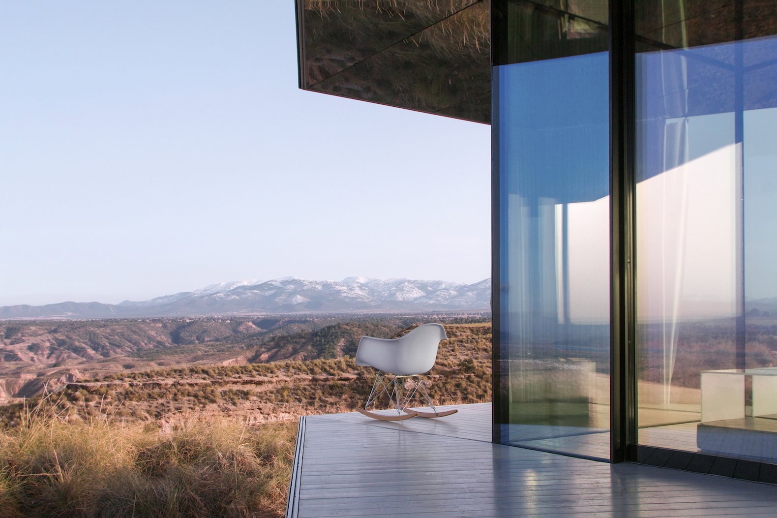 Near-invisible coatings on the glass protect the interior from solar gain.