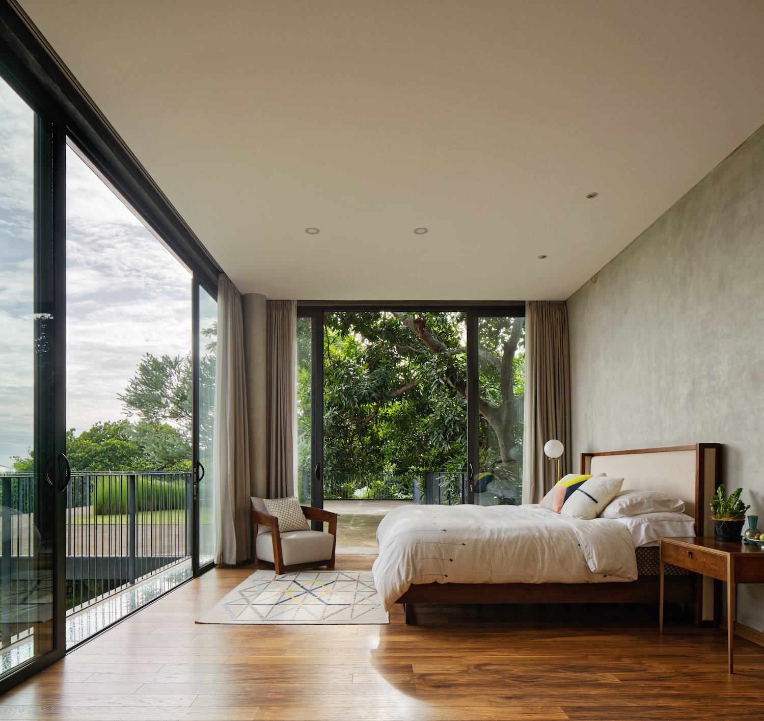 The bedroom on the second floor has a treehouse-like feel.
