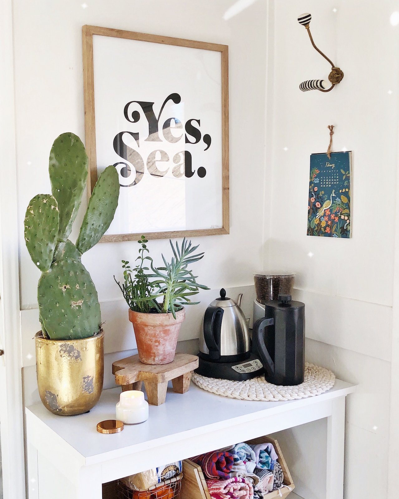 Pops of greenery and art imbue warmth into the tiny home.